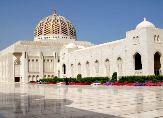 Exterior view of the Sultan Qaboos Grand Mosque on a sunny day, Wilayat Bawshar, Muscat Oman